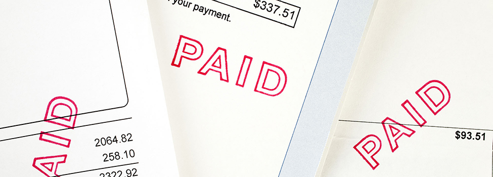 Three Invoices with Paid Stamp - three invoices, all have been stamped paid.