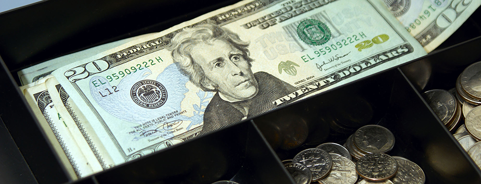 cash box full of money, bills and coins