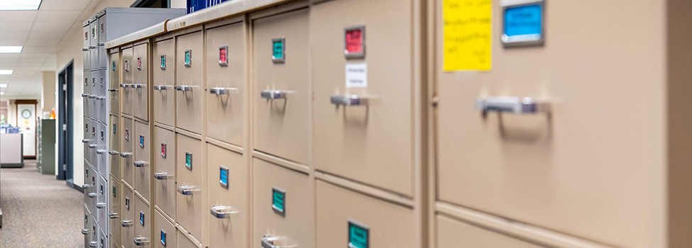 Long row of filing cabinets in an office space