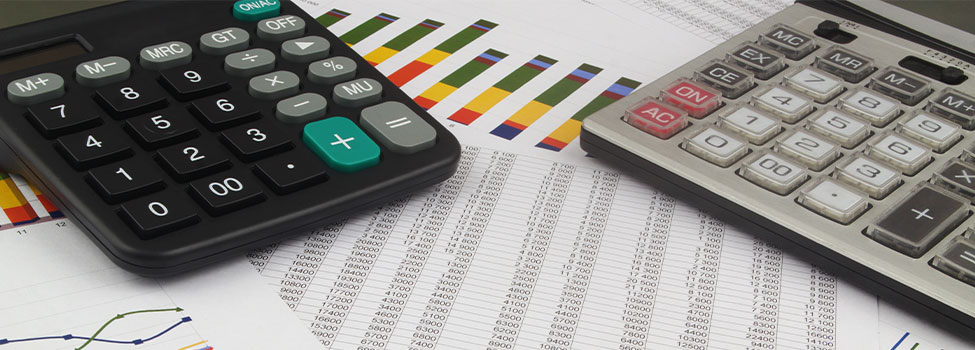 Two calculators set atop spreadsheets and graphs.